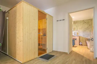 a room with a large wooden closet in a room at Camping maeva Escapades Colomba in Olmeto