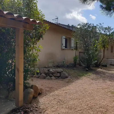 a house with a garden in front of it at Villa Ribba 10 pers piscine 5 min plage en voiture in Porto-Vecchio