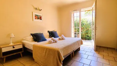 a bedroom with two beds with towels on them at Villa Lucendiluna 14 personnes piscine plage 5min le paradis in Sainte-Lucie de Porto-Vecchio