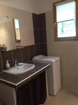 a bathroom with a sink and a toilet at Caselena , un havre de paix en Balagne in Ville-di-Paraso