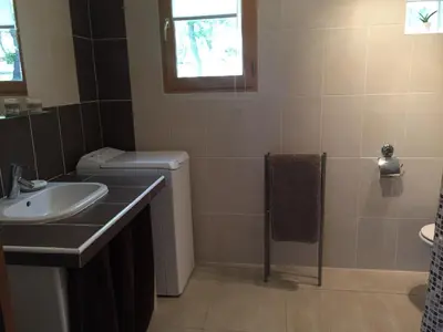 a bathroom with a sink and a toilet at Caselena , un havre de paix en Balagne in Ville-di-Paraso