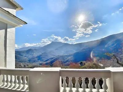 a balcony with a view of the mountains at U Castellu di A Sulana in Casabianca