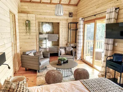 a log cabin living room with a couch and a table at U Castellu di A Sulana in Casabianca