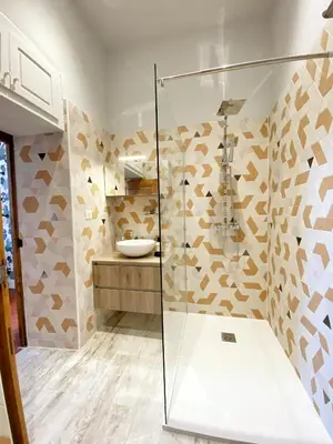 a bathroom with a shower and a sink at U Castellu di A Sulana in Casabianca