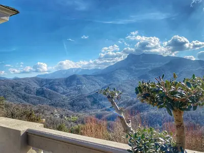 a view of the mountains from a balcony at U Castellu di A Sulana in Casabianca