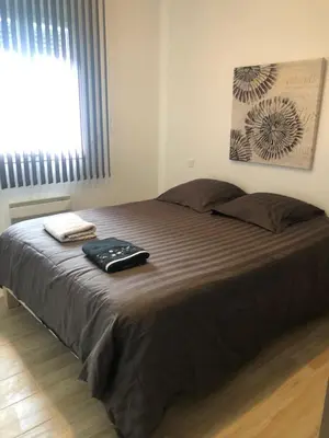 a large bed in a bedroom with a window at Mare e Monti in Aléria