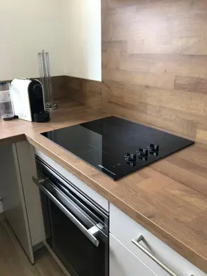 a kitchen with a black stove top on a counter at Mare e Monti in Aléria