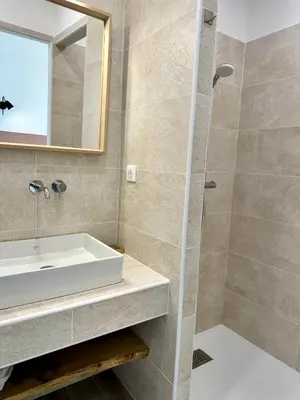 a bathroom with a sink and a shower at Somptueuse villa d’architecte avec vue mer in Belvédère
