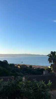a view of the ocean from a house at Duplex F4-2 balcons face a la mer in Ajaccio