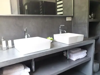 two sinks on a counter in a bathroom at A Muredda in Figari