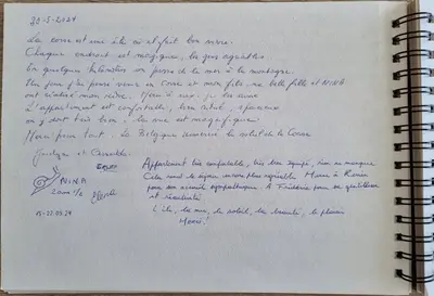 a notebook with a handwritten letter in handwriting at Agosta Sea View in Porticcio