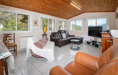 a living room with leather furniture and a flat screen tv at Amazing Home In Morosaglia With Wifi in Morosaglia