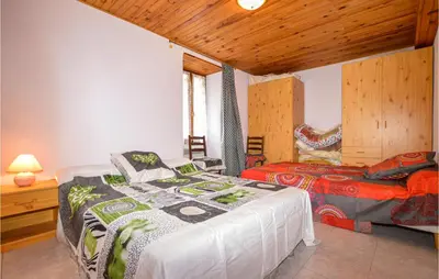 a bedroom with two beds in a room at Amazing Home In Morosaglia With Wifi in Morosaglia