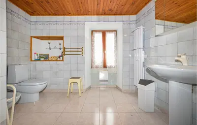 a bathroom with a toilet and a sink at Amazing Home In Morosaglia With Wifi in Morosaglia
