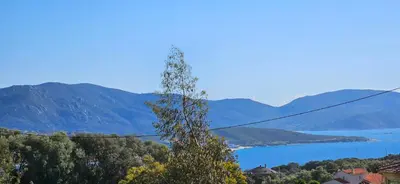 a view of a lake and mountains at Mini villa T3 climatisée, vue mer, cosy & moderne in Olmeto