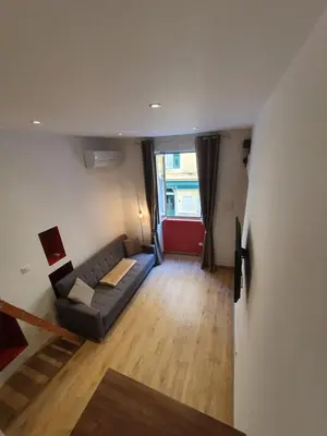 a bunk bed in a small room with a bed at Studio entièrement rénové vieille ville in Ajaccio