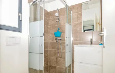 a bathroom with a shower and a sink at Cala Di Mare in Lecci