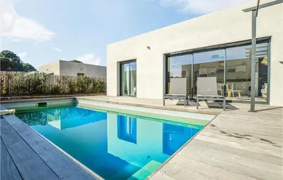 a swimming pool in front of a house at Cala Di Mare in Lecci