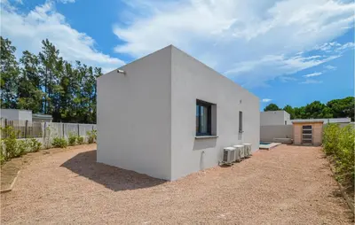 a white building with a window on the side of it at Cala Di Mare in Lecci
