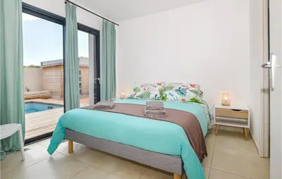 a bedroom with a bed and a large window at Cala Di Mare in Lecci