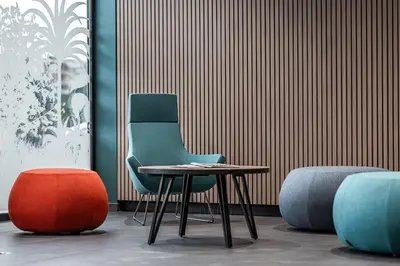 two chairs and a table in front of a wall at Holiday Inn Express Ajaccio by IHG in Ajaccio