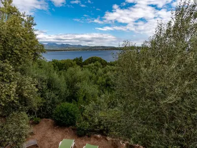a view of a body of water with trees at Villa Villa Pavellone by Interhome in Porto-Vecchio