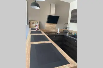 a kitchen with a counter top and a sink at Suite spacieuse avec accès piscine in Ghisonaccia
