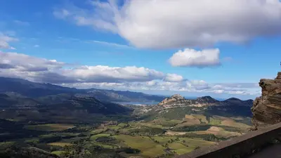 a view of a valley with mountains and a blue sky at Résidence U Nebbiu in Olmeta-di-Tuda