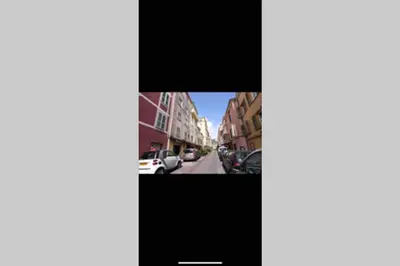 a television screen showing a street with cars parked at Ajaccio magnifique T2 neuf 40m2 avec balcon au Trottel 4 couchages wifi Clim parking plage à pieds 100m in Ajaccio