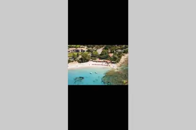 an aerial view of a beach and the ocean at Ajaccio magnifique T2 neuf 40m2 avec balcon au Trottel 4 couchages wifi Clim parking plage à pieds 100m in Ajaccio