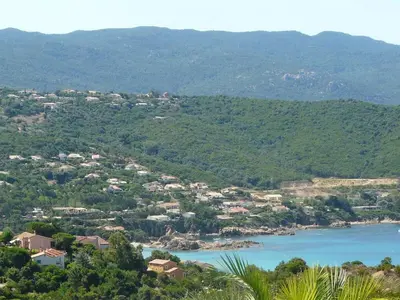 a view of a town with a river and mountains at Superbe villa avec piscine vue mer, proche plage et Porticcio in Pietrosella