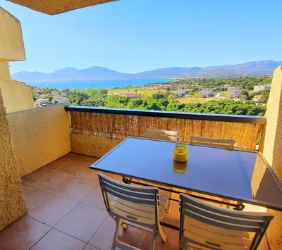 a ping pong table on a balcony with a view at Porticcio - Casa Corsa in Porticcio