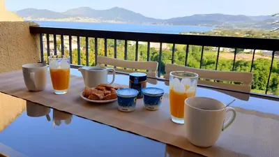 a table with a tray of breakfast foods and drinks at Porticcio - Casa Corsa in Porticcio