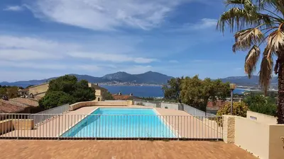 a swimming pool with a view of the water at Porticcio - Casa Corsa in Porticcio
