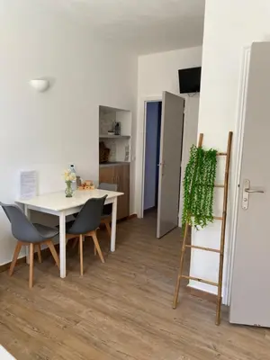 a kitchen and dining room with a table and chairs at BERNARDINI Emplacement exceptionnel in Sari Solenzara