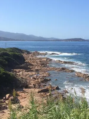 a view of the ocean from a rocky beach at Stella mare à porticcio in Porticcio