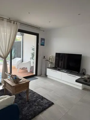 a living room with a large flat screen tv at Stella mare à porticcio in Porticcio