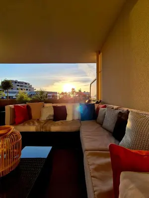 a living room with a couch and a large window at T2 de standing front de mer in Propriano