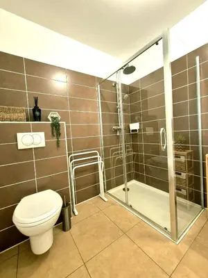 a bathroom with a shower and a toilet and a shower at T2 de standing front de mer in Propriano