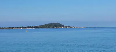 an island in the middle of a large body of water at Studio situé à 20 metres de la plage d Agosta Porticcio in Albitreccia