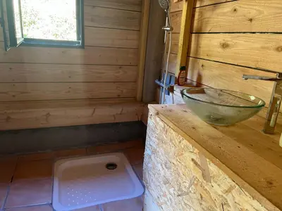 a bathroom with a sink and a bowl on a counter at Cabane 2 in Olivese