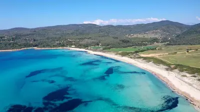 an aerial view of a beach with blue water at Superbe appartement en plein coeur d'Ajaccio in Ajaccio
