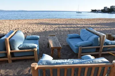 a group of chairs and a table on a beach at Superbe appartement en plein coeur d'Ajaccio in Ajaccio