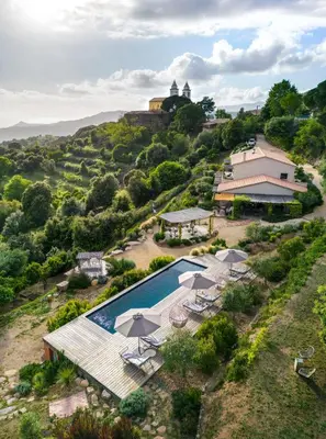 an aerial view of a villa with a swimming pool at Terre de Maquis, maison d'hôtes vue mer Corse in Sari-dʼOrcino