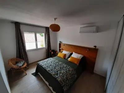 a bedroom with a bed and a window at Villa_Culomba ALATA -T2 4 couchages in Alata