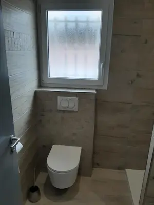 a small bathroom with a toilet and a window at Villa_Culomba ALATA -T2 4 couchages in Alata