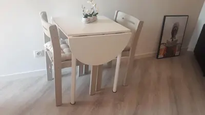 a white table and chairs in a room at Magnifique Studio bord de mer numéro 88 in Santa-Lucia-di-Moriani