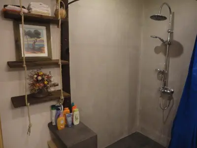 a shower stall in a bathroom with a shower at Villa de plein pied en campagne bonifacienne 84m2. in Bonifacio
