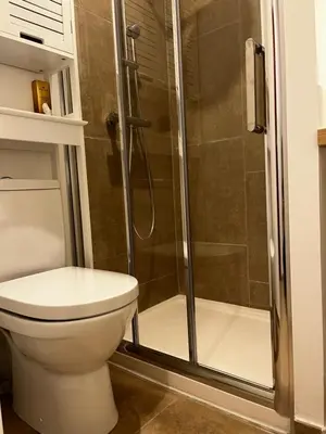 a bathroom with a toilet and a shower at Charmant studio au cœur de la rue Fesch d'Ajaccio in Ajaccio