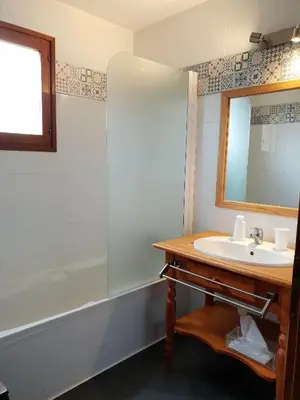 a bathroom with a sink and a mirror at A Casa Aperta in Favalello